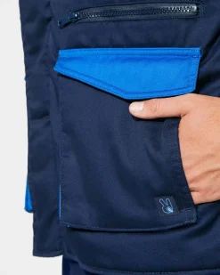 Roly CQ8414 - ARMADA Gilet de travail multi-poches avec col montant en couleurs combinés