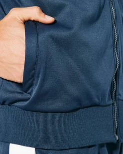 Roly CH6410 - CRETA Survêtement composé d´une veste et un pantalon